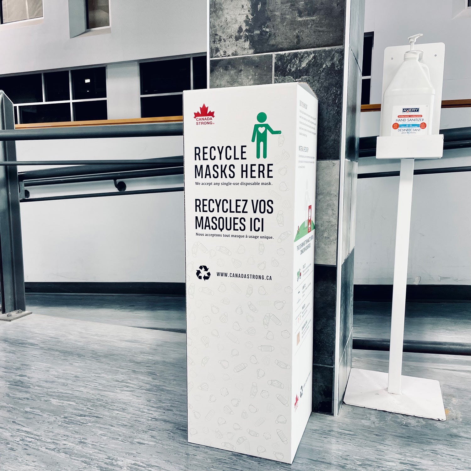 Face mask and N95 recycling box in an office hallway meeting area of a workplace in Canada.