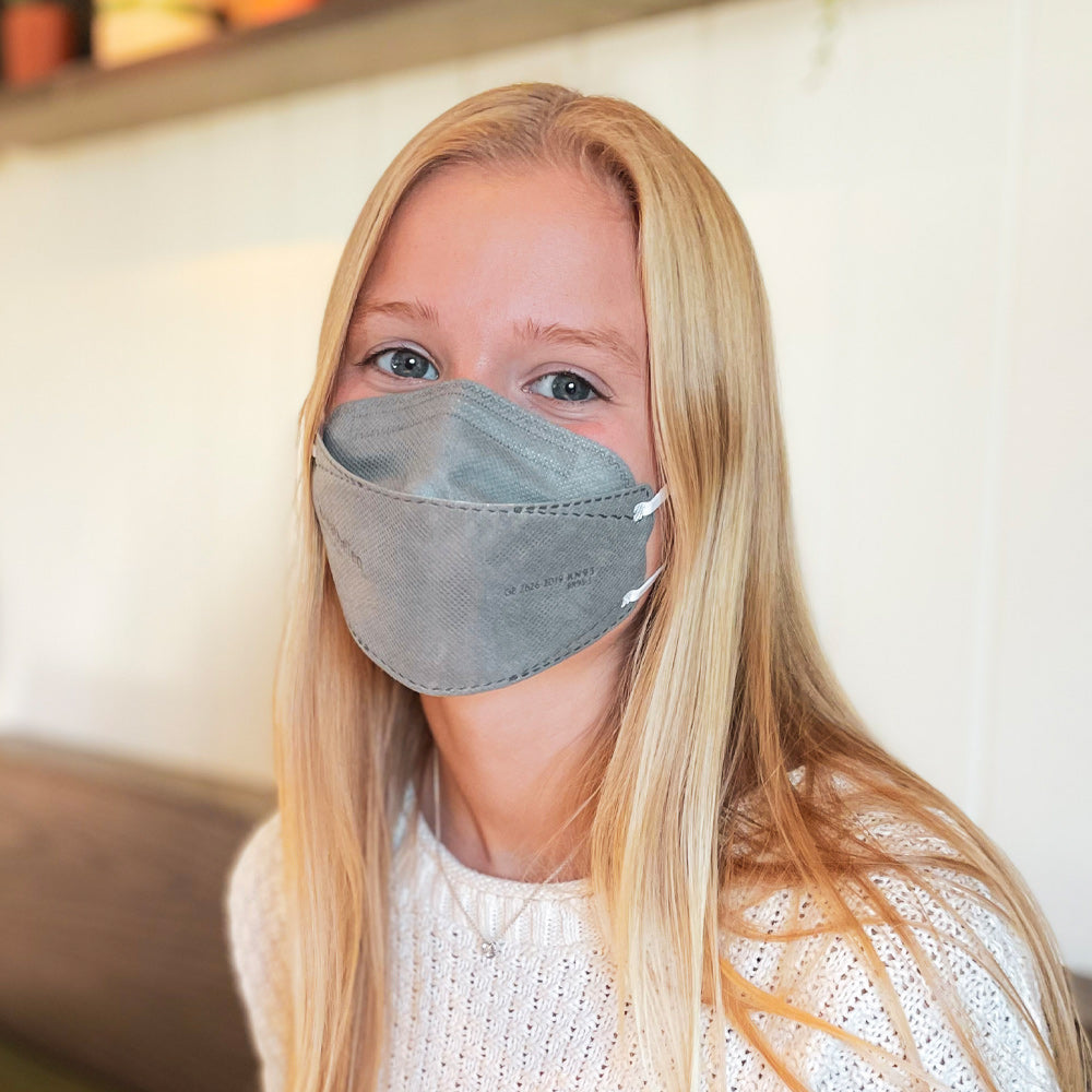 Young woman teen petite wearing BreatheTeq KN95 small grey Canada Masq respirator mask made in canada